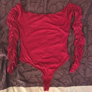 Lulu’s long-sleeved bodysuit. US size XS. Burgundy. Never worn, tags removed.